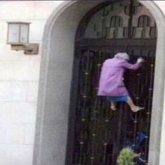 an old woman climbing into a door with her feet in the air