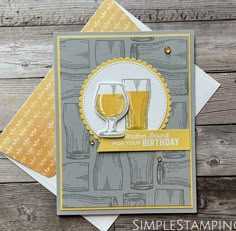 a card with two glasses of beer on top of each other, and the words happy birthday