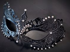 This captivating set includes two stunning masks, both designed in the classic Venetian style. The mask is adorned with sparkling rhinestones, reflecting the light and adding a touch of enchantment to her look while the black mask includes shimmer and exudes strength and sophistication, making him a charismatic presence at any masquerade or other special events.


Age Group/Gender - Adult/Unisex

Size/Type - One size fits all adults

Mask Color - Black
Mask Material - Metal women's, polyresin me Elegant Formal Masquerade Mask For Halloween, Elegant Evening Mask For Carnival, Elegant Evening Masks For Carnival, Gothic Evening Masquerade Eye Mask, Gothic Eye Mask For Evening Masquerade, Elegant Black Masquerade Mask For Halloween, Elegant Black Eye Mask For Masquerade, Elegant Black Masks And Prosthetics For Party, Elegant Black Masks And Prosthetics For Evening