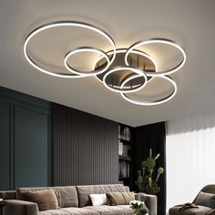 modern living room with round lights and couches