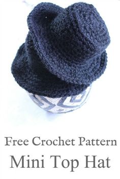 a crochet hat sitting on top of a cup with text overlay that reads free crochet pattern mini top hat