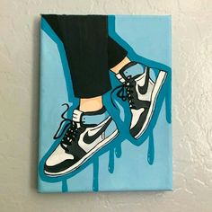 a painting of a pair of sneakers on a blue background