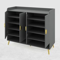 a black cabinet with yellow handles and shelves on the bottom, against a white background