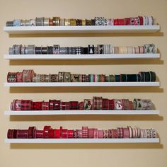 the shelves are filled with many different types of ribbons