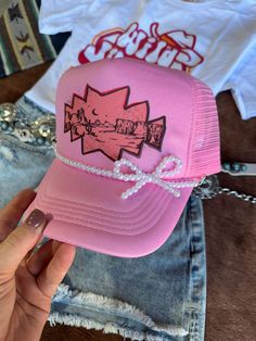 The Pink Desert Trucker Hat is a playful accessory that captures the essence of sunny adventures! Featuring a vibrant pink color and a classic mesh-back design, this hat is perfect for adding a pop of fun to any outfit. Whether you're hitting the trails or just enjoying a day out, it's the perfect way to stay stylish and shaded! One Size Fits Most White Pearl Bow Hat Chain NOT included Hat Chain, Pink Desert, Pearl Bow, Plus Size Shopping, White Pearl, Hat Hairstyles, Hat Sizes, Long Sweaters, The Pink