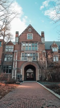 an old building with a brick walkway leading to it