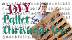 a man holding up a pallet christmas tree with the words diy on it