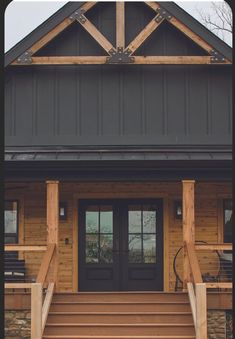 the front porch of a house with steps leading up to it's entry door