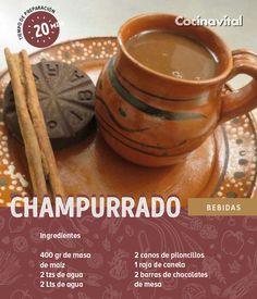 a cup of hot chocolate next to cinnamon sticks on a plate with the words chapurado written in spanish