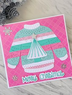 a christmas card with an ugly sweater on it and snowflakes in the background