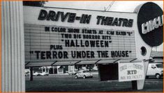 the drive - in theatre sign has been vandalized and is now on display