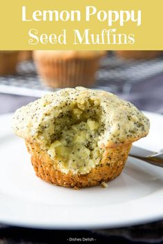 lemon poppy seed muffins on a white plate with a fork and cupcake in the background