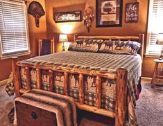 a bed room with a neatly made bed and pictures on the wall