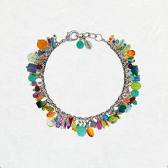 This Bright Confetti Bracelet has to be one of the cutest and most colorful accessories that we have ever seen! This beauty features multi-color Czech glass and crystals. This design is covered with charms that vary in shape and size and come together to create a beautiful mosaic of color. This happy design is sure to be a fun accessory to style. You can use this bracelet as a focal point and style your look around this piece. The options are sure to stun. The Confetti collection has our eyes en Bohemian Multicolor Metal Charm Bracelet, Bohemian Style Multicolor Metal Charm Bracelet, Multicolor Charms Party Bracelet, Multicolor Crystal Bracelet Jewelry, Multicolor Nickel-free Crystal Bracelet, Multicolor Dangling Charms Jewelry For Party, Multicolor Jewelry With Dangling Charms For Party, Multicolor Czech Glass Bracelets For Party, Multicolor Beaded Metal Charm Bracelet