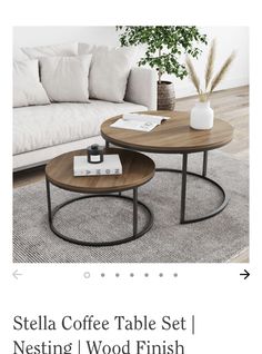 two coffee tables sitting on top of a rug in front of a couch and table