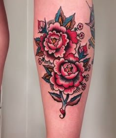 a woman's leg with flowers on it