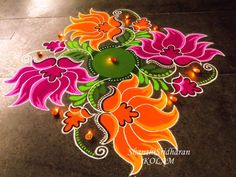 colorful rangdi design on the ground for diwaling with lights and watercolors