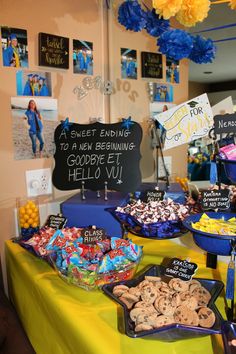 a table filled with lots of different types of snacks and desserts on it's sides