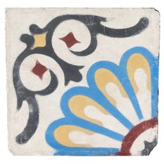 an artistic tile design with blue, yellow and red designs on the outside of it