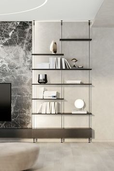 a modern living room with marble walls and shelves