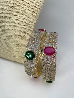 Traditional Bangles comes in set of 2Color : GoldenSize : Size : 2.4Stones : AD Red Green Stone Green Stone Bangles, Traditional Bangles, Stone Bangles, Stone Bangle, Social Events, Green Stone, Indian Jewelry, Red Green, Bangles