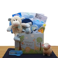 Send your best to new baby AND proud parents with this adorable Welcome New Baby gift box. Packed with cute baby necessities like a ceramic bank, blanket, bodysuit, plush lamb, booties, and more. This gift is a great way to celebrate baby. The Welcome New Baby Gift Box includes: Plush lamb with bunny booties, ceramic lamb piggy bank, Baby's first tooth & Curl keepsake box, baby brush and comb set, baby manicure set, receiving blanket, set of 4 baby washcloths, two 100% cotton baby beanie's, two 100% cotton baby bodysuits, two 100% cotton baby bootie sets. This gift measures 11" long by 9" wide and 16" tall and weighs 8 pounds. This gift comes wrapped in cellophane and is topped with a handmade bow. Disclaimer: *All contents subject to change based on availability at time of purchase. Any a Baby Boy Gift Baskets, Welcome New Baby, Unique Gift Baskets, Proud Parents, Baby Keepsake Box, Baby Shower Gift Basket, Baby Washcloth, Baby Necessities, Baby Gift Box