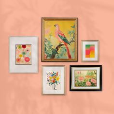 there are many framed pictures on the wall with flowers and birds in them, all hanging up