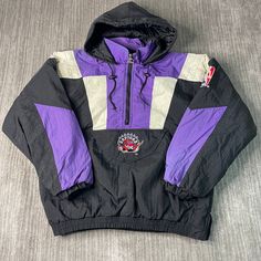 Vintage 90s Toronto Raptors Starter NBA Basketball Sportswear Athletic 1990s Fashion Black Pullover Jacket Large Mens Condition:  Fair Used Condition  = Has staining On The Shoulder Area Due To Age And Wear  Measurements: Please see photos above for all measurements IF YOU BUY TWO OR MORE ITEMS USE THE CODE BUNDLE @ CHECK TO SAVE 20% WE SHIP WITHIN 24 HOURS AFTER PURCHASE! Please be aware that we do not offer free returns!! The Buyer is responsible for the cost of the return label. Follow us on Sporty Purple Track Jacket For Streetwear, 90s Style Black Hooded Windbreaker, 90s Black Hooded Windbreaker, Black 90s Style Hooded Windbreaker, Vintage Black Sports Windbreaker, Vintage Black Windbreaker For Sports, Vintage Black Windbreaker For Outdoor Activities, Starter Jacket Outfit, Throwback Track Jacket For Streetwear And Sports Season