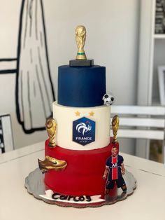 a cake that is on top of a table with a figurine next to it