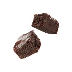 two pieces of chocolate cake sitting on top of each other