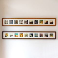 two wooden shelves with pictures on them against a white wall