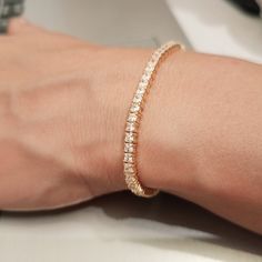 "D I A M O N D ∙ T E N N I S ∙ B R A C E L E T ∙ W O M E N ∙ 18K gold plated sterling silver.  Best gift for her. Gift for wife. Valentine's day gift idea.  ✓Gold tennis bracelet perfect for spoiling yourself or gifting. ✓ Diamond tennis bracelet it will be the right choice for your daily use. Style: Minimalist jewelry * Gold chain bracelet * Diamond tennis * Birthday gift * Bracelet  women * CZ tennis bracelet * Birthday gifts * P R O D U C T - D E S C R I P T I O N  ✓Our 18k gold plated jewelr Tarnish-resistant Tennis Bracelet For Weddings, Adjustable Tarnish Resistant Tennis Bracelet For Formal Occasions, Formal Adjustable Tarnish Resistant Tennis Bracelet, Rose Gold Tennis Bracelet With 17 Jewels, Elegant Cubic Zirconia Bracelets For Gifts, Elegant Cubic Zirconia Bracelets As Gift, Elegant Cubic Zirconia Bracelet Gift, Classic Rose Gold Plated Bracelets, Elegant Tarnish-resistant Tennis Bracelet For Weddings