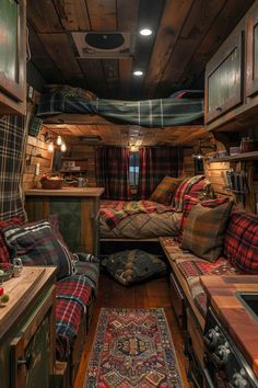 a living area with couches, rugs and other items in the cabin on wheels