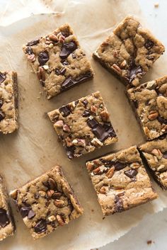 chocolate chip cookie bars cut into squares on parchment paper