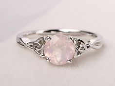 Welcome to my shop, you can find many beautiful gemstone jewelry here, and you also can ask for customized service. Main Stone: Natural pink quartz , round cut 7 mm Accent Stones: None Metal: 925 sterling silver plated with rhodium so as to protect the ring from tarnish and keep it shinning. I also can provide metal options such as 14k solid yellow/white/rose gold Setting: bezel setting more rings: https://www.etsy.com/shop/XCjewelryStudio?ref=hdr_shop_menu It's quite comfortable for wearing and Rose Quartz Wedding Rings, Rose Quartz Engagement Ring Silver, Rose Quartz Wedding Ring Silver, Round Rose Quartz Promise Ring, Rose Quartz Promise Ring, Engagement Rings Celtic, Pink Stone Engagement Rings, Rose Quartz Heart Ring, Silver Rose Quartz Crystal Ring Gift