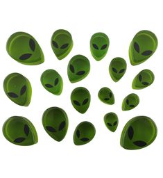 twelve green alien heads with black eyes on each one, set against a white background