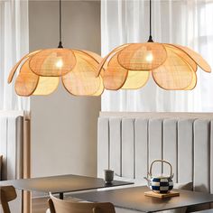 three lights hanging over a dining room table