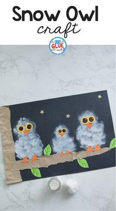 an owl craft made with toilet paper and scissors