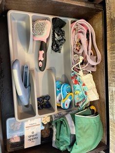 an open drawer with various items in it