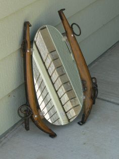 a mirror sitting on the side of a building