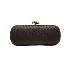 Bottega Veneta black intrecciato woven leather knot clutch bag brass tone harware The Knot is one of Bottega Veneta's most beloved handbags. The rounded box clutch, based on an archival shape and reintroduced in 2001, is a masterpiece of design and artisanal craftsmanship. Interpretations of the Knot have ranged from the understated to the extravagant over the years, each new style confirming the irresistible beauty and timeless charm of this iconic bag. This Knot comes in black leather and is t Rectangular Clutch With Intrecciato Weave For Evening, Evening Clutch With Intrecciato Weave, Rectangular Intrecciato Weave Clutch For Evening, Designer Evening Clutch With Intrecciato Weave, Elegant Woven Leather Evening Clutch, Elegant Woven Leather Clutch For Evening, Formal Woven Leather Clutch, Elegant Evening Clutch With Woven Leather, Elegant Evening Woven Leather Clutch