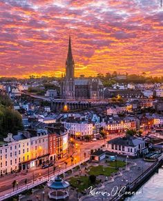 an aerial view of a city at sunset