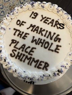 a cake with writing on it that says 19 years of making the whole place shiner