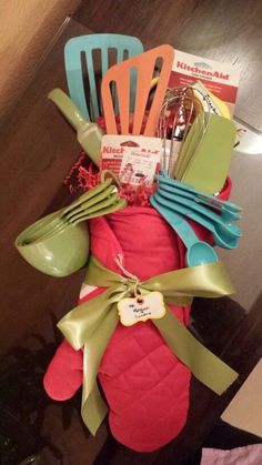 an assortment of kitchen utensils in a basket