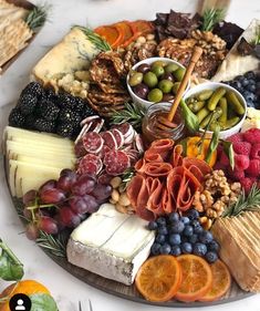 an image of a platter with cheeses, fruits and nuts on it for instagram