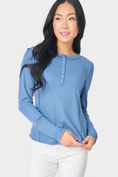 This closet-staple soft thermal henley features versatile snap-front buttons, raw-edged seam details, and a figure-flattering fit. Perfect on its own or as a layer. Created in collaboration with Lindsey of The Motherchic. 94% Polyester | 6% Spandex Delicate Wash Cycle, Dry Flat. Length 25 1/4" (size small) Jing is 5'8 and wearing size XXS Layered Blouse, Henley Tee, Back 2 School, Thermal Long Sleeve, Light Denim, Black Denim, Fashion Looks, Style Fashion, Rust