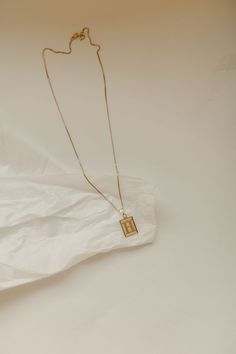 My not-so-basic letter necklace. The perfect initial necklace to go with any look! 18 inches in length. ∙ D E T A I L S ∙- 18k Gold Filled Box Chain- Dainty Box Chain- 18k Gold Filled Pendant - 18 or 20 inches length Hypoallergenic (lead + nickel free) Tarnish and Water Resistant ∙ G O L D ∙ F I L L E D ∙ Gold-filled components contain 100+ times more real gold than gold-plated components and are both durable and tarnish resistant. It is more affordable and accessible than solid gold but higher quality than gold plated. Initial Pendant Necklace With Box Chain As Gift, Classic Initial Pendant Necklace With Box Chain, Initial Pendant Necklace On Box Chain For Gifts, Minimalist Box Chain Initial Necklace As Gift, Gold Initial Necklace With Box Chain As Gift, Gift Initial Pendant Necklace With Box Chain, Gift Initial Pendant Necklace On Box Chain, Minimalist Gold Rectangular Initial Necklace, Gold Rectangular Minimalist Initial Necklace