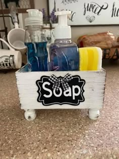 soap and hand sanitizers in a wooden crate on a countertop with other items