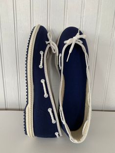 New from the early 80s, deadstock blue and white slip on tennis shoes. Simple flats with sweet bow tie and rope around top. Rubber sole with plenty of grip. Perfect, unworn condition. Made in USA Condition - New from the early 80s, unworn and in original condition! Size - 6 Please contact us if you are unsure about sizing or have any questions. Thank You! Grit and Glam Shoes 70s, Sailor Shoes, On Tennis Shoes, Argyle Vest, Slip On Tennis Shoes, Women's Slip Ons, White Slides, White Slip, Slides Shoes