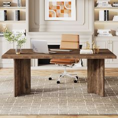 a desk with a laptop on it in front of bookshelves